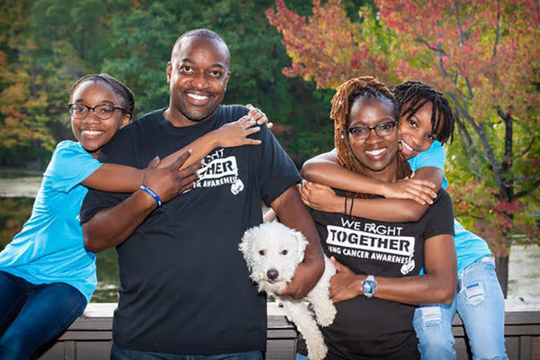 Alesha Arnold, registered nurse and lung cancer patient, with her family
